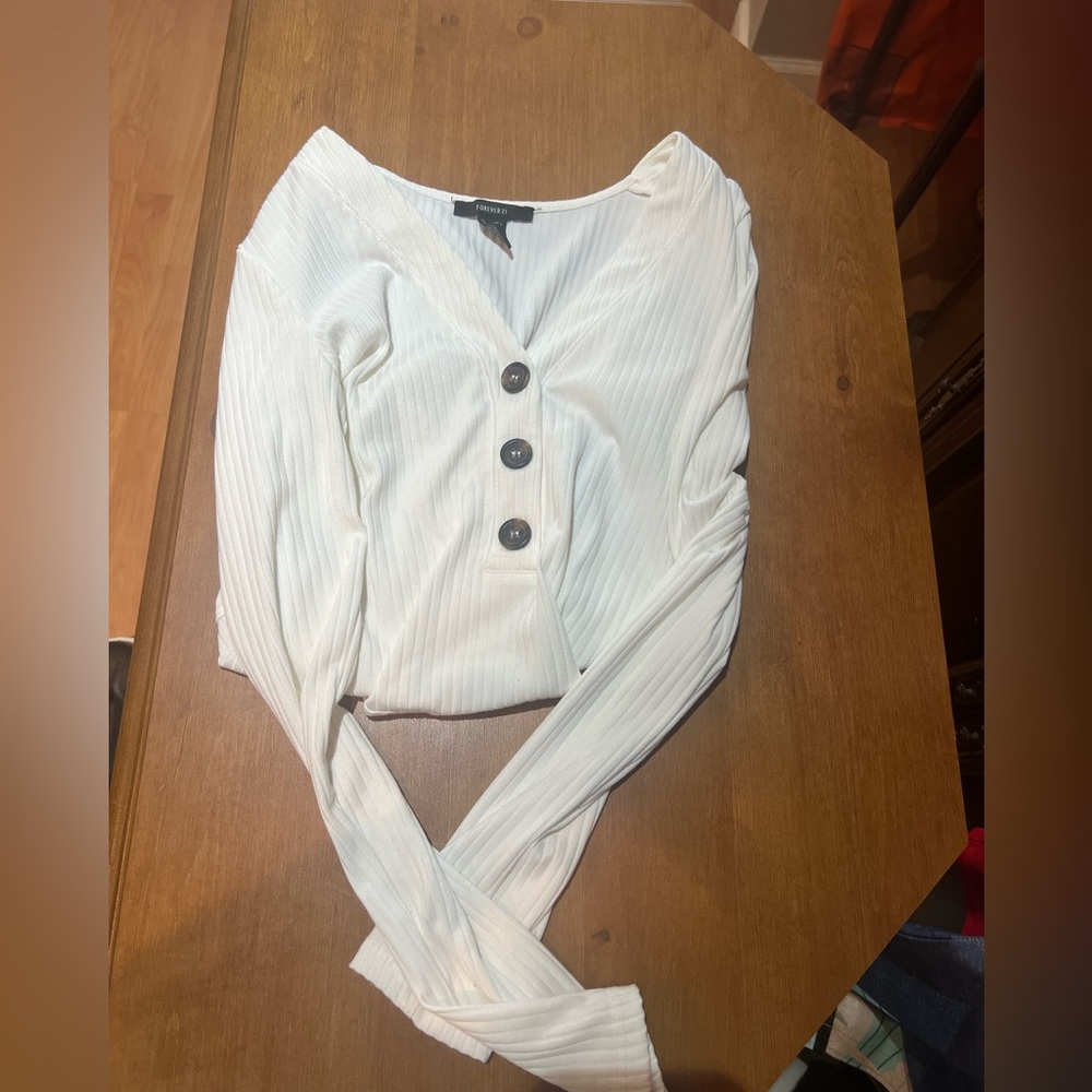 White bodysuit with brown buttons